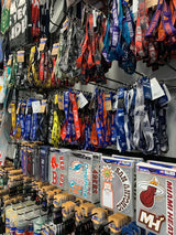 A collection of colorful, branded lanyards hanging in rows.