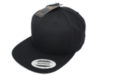 Black snapback cap with flat brim and tag, sports hat fashion accessory