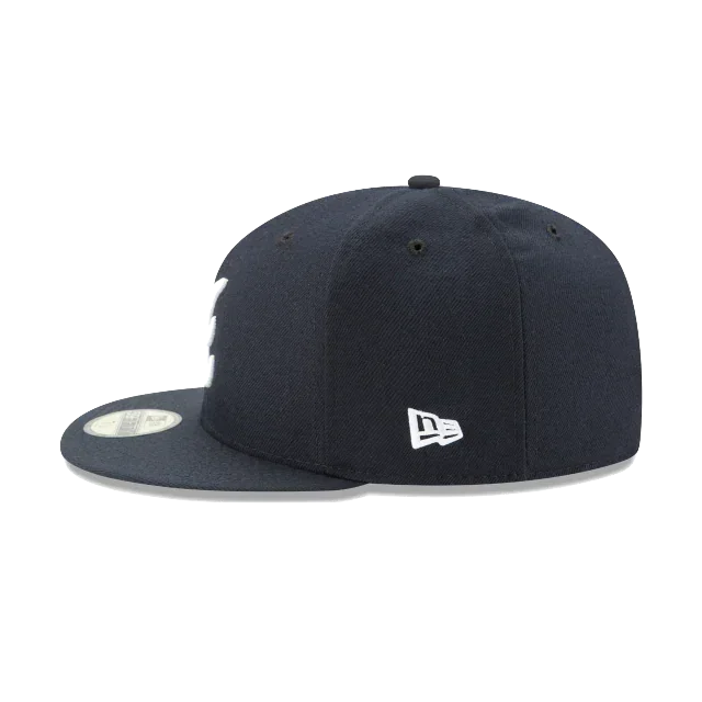 Navy blue fitted baseball cap with flat brim and white New Era logo on the side