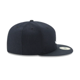 Black fitted flat brim cap with sticker, six panels, side view on white background