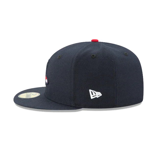Navy blue fitted sports cap with flat brim, New Era logo, and red top button