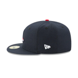 Navy blue fitted sports cap with flat brim, New Era logo, and red top button