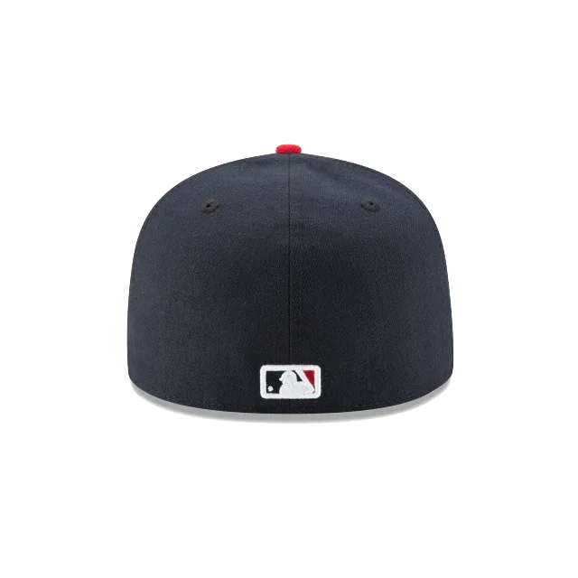 Back view of navy blue fitted MLB baseball cap with logo and red button on top
