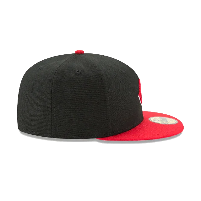 Black and red fitted sports cap with flat brim, side view