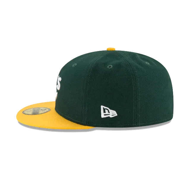 Green and yellow fitted baseball cap with flat brim and embroidered logo on the side