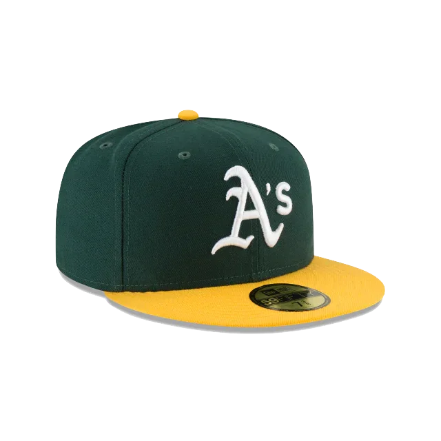 Green and yellow fitted baseball cap with white A's logo on the front.