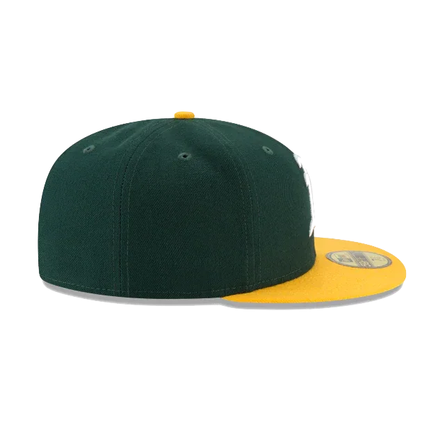 Green and yellow fitted sports cap with flat brim, side view on white background
