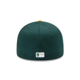 Dark green fitted baseball cap rear view with MLB logo patch and yellow top button
