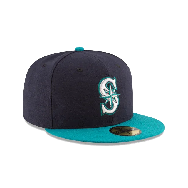 Navy and teal fitted baseball cap with embroidered S logo on front, flat brim
