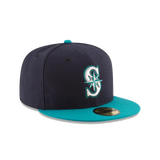 Navy and teal fitted baseball cap with embroidered S logo on front, flat brim