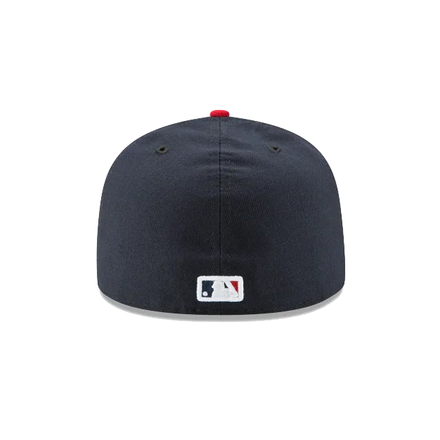 Back view of navy fitted MLB cap with official league logo and red top button