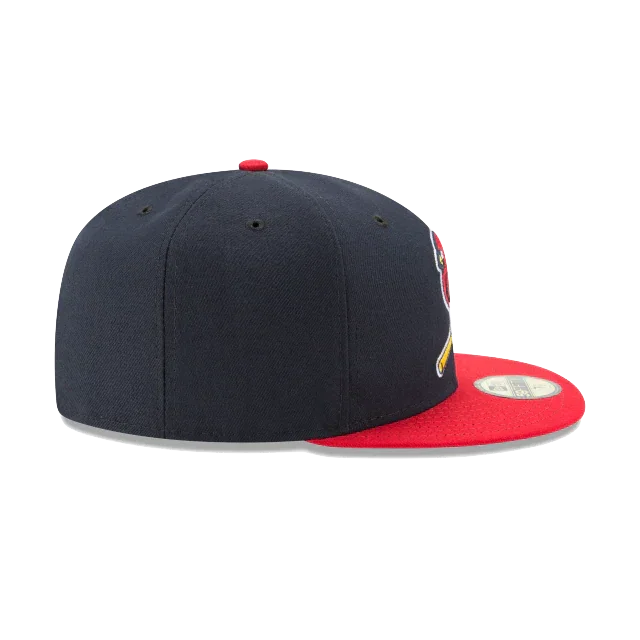 Navy blue fitted baseball cap with red flat brim and side sports team logo