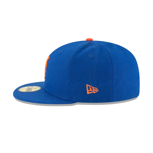 Royal blue fitted cap with flat brim, orange embroidered logo on the side, sports hat style