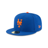 Blue fitted baseball cap with orange NY logo and flat brim, New Era sports hat