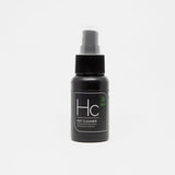 Black spray bottle of Hc hat cleaner for waterless hat cleaning on white background