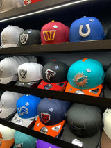 A vibrant teal and orange miami dolphins new era 59fifty fitted cap with a bold embroidered logo.
